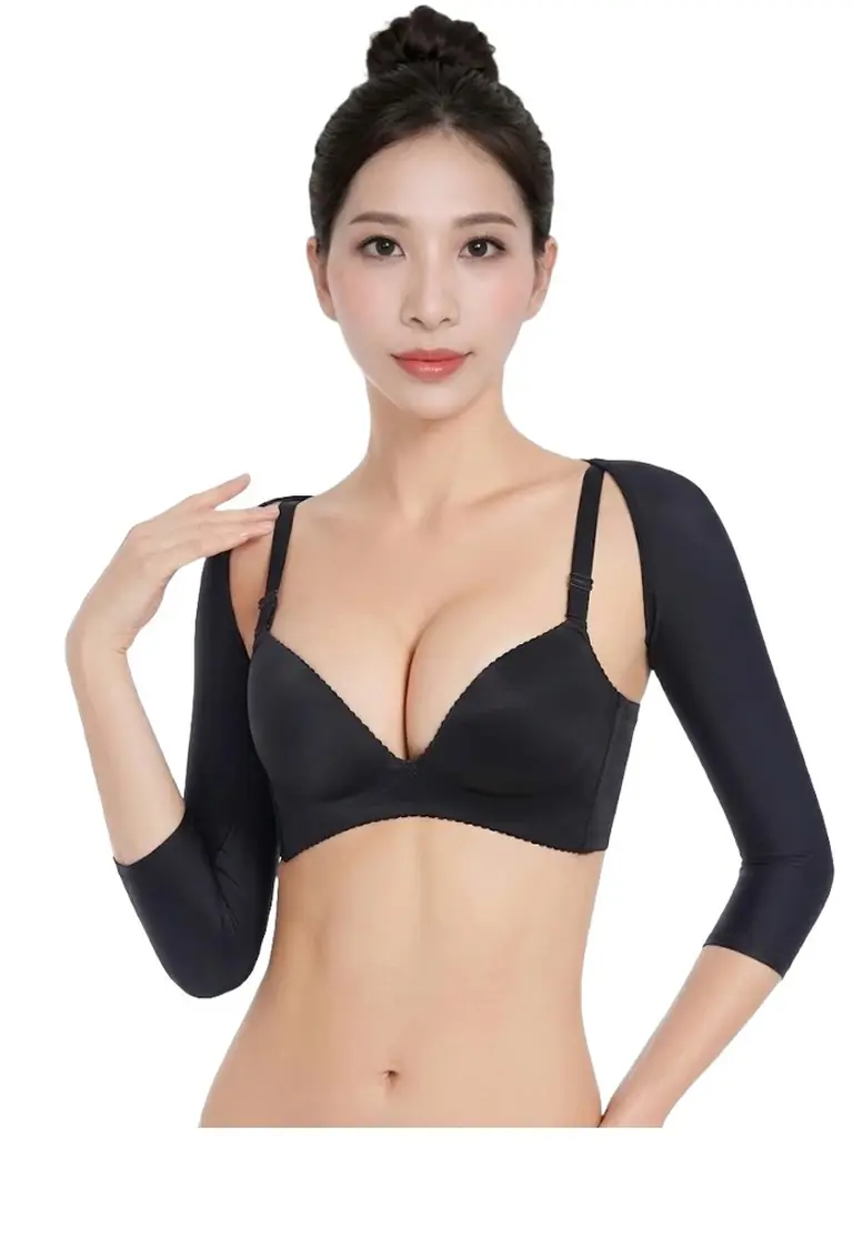 Upper arm liposuction recovery sleeves seamlessly and discreetly worn under daily everyday clothing.